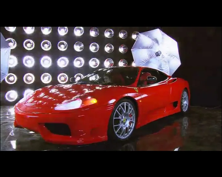Red sports car in a reflective studio effects shot